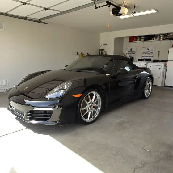 Black Porsche Boxster front view after detailing