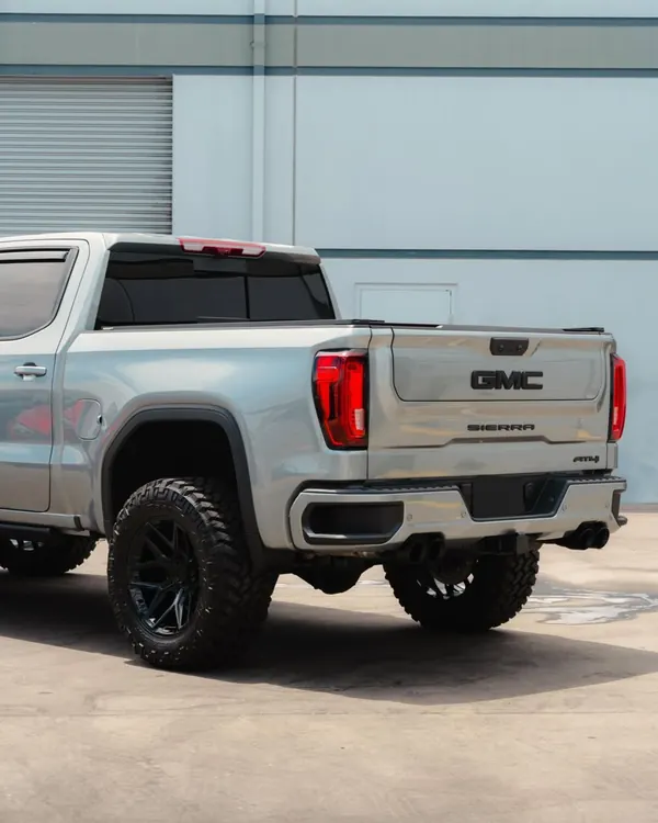 Detailed grey GMC Sierra AT4, rear view