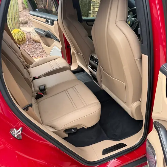 Red Porsche Cayenne rear bench in tan leather after an interior detail