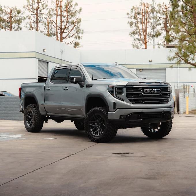Lifted GMC with a deep glossy finish