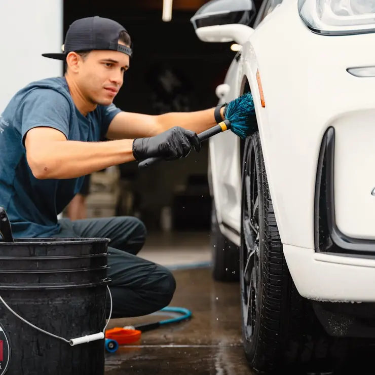 Detailing a wheel during a full vehicle wash