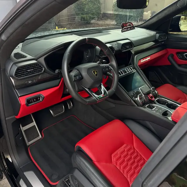 Red and black Lamborghini Urus interior after a detail