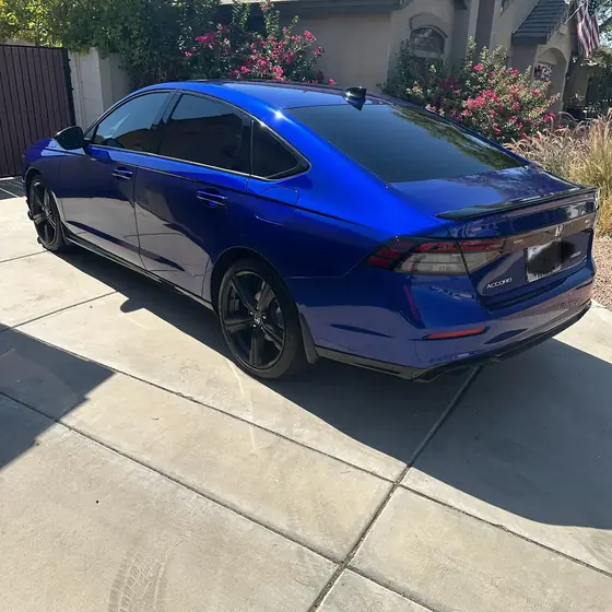 Rear view of a blue Honda Accord with a mirror-shine finish