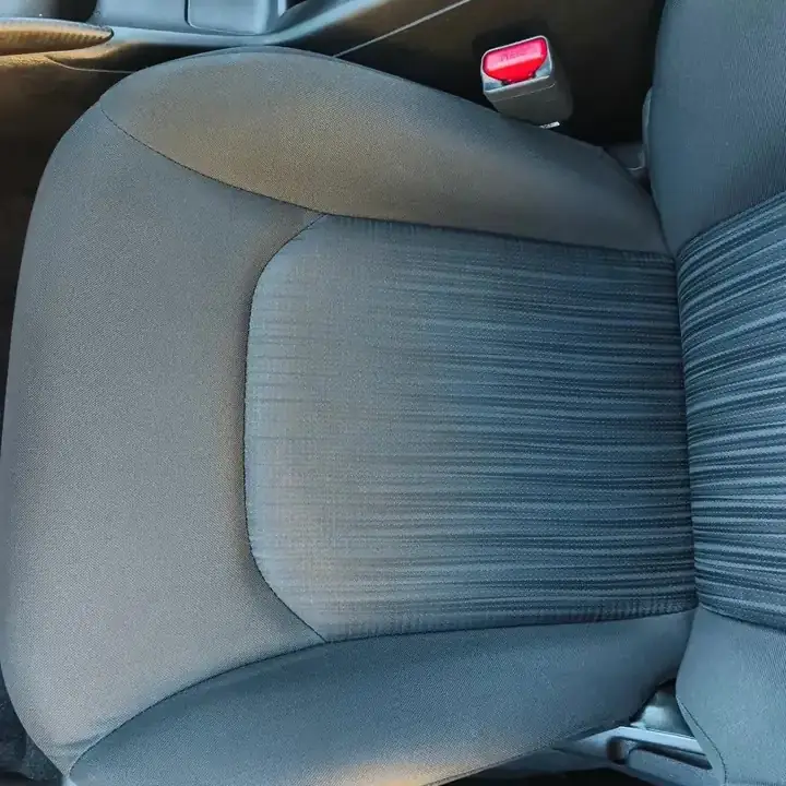 The same front seat after shampooing, clean and even