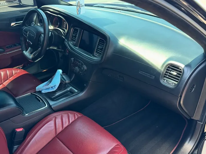 Dodge Charger dash and red seats after a detail