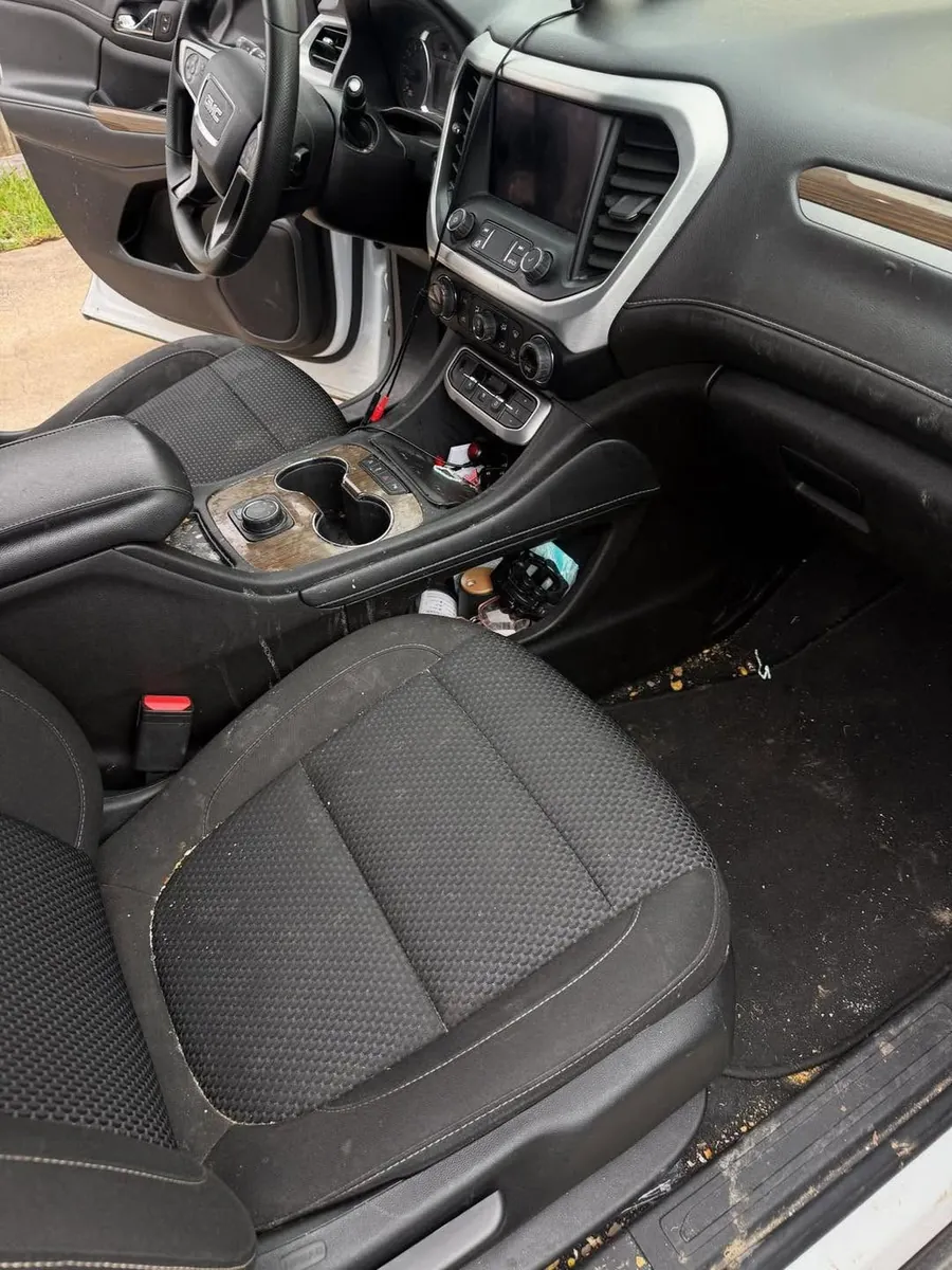 Front seat and floor before, crumbs and dirt everywhere