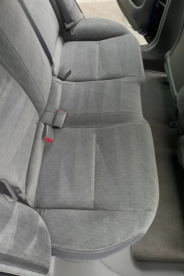 The same back seat after a shampoo, clean and even