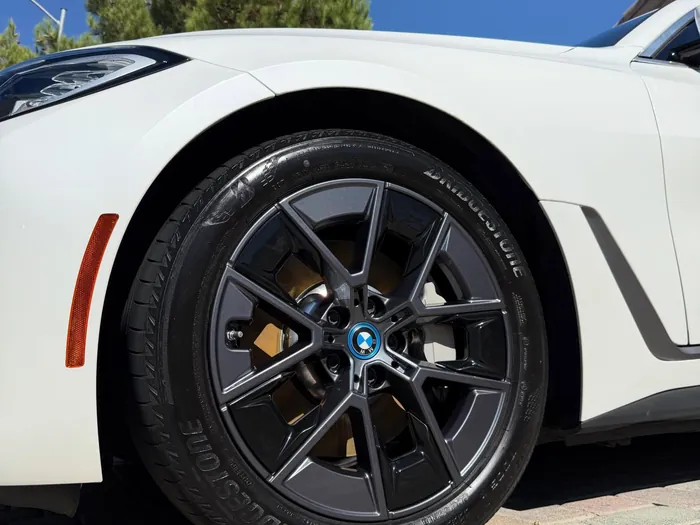 Clean black wheel on a white BMW