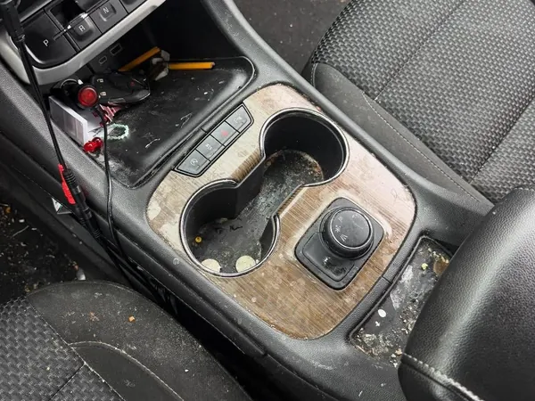 GMC Acadia center console before, sticky cup holders and crumbs