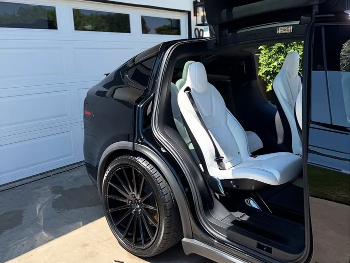 Black Tesla Model X with doors up