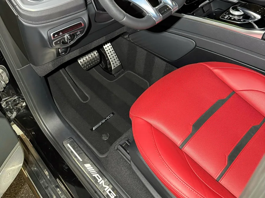 Mercedes G 63 driver's side after an interior detail, red leather seat and clean mats