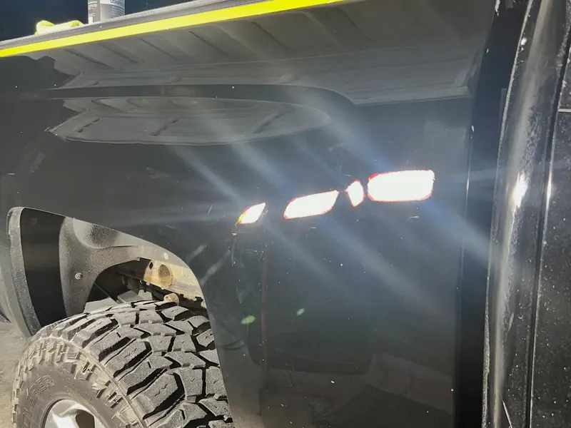 The same fender after polishing, with clear reflections